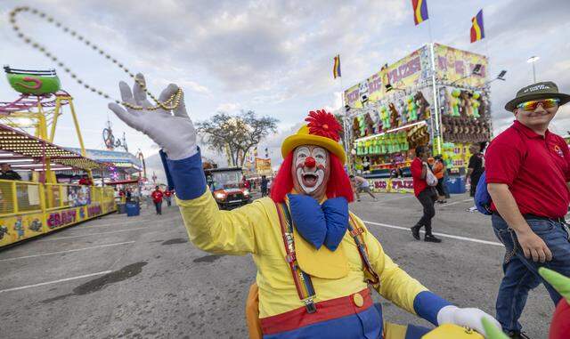 Tadpole throws festive beads toward guests during the opening day of the 74th annual Miami-Dade County Youth Fair on Thursday, March 12, 2026, in Miami, Fla.