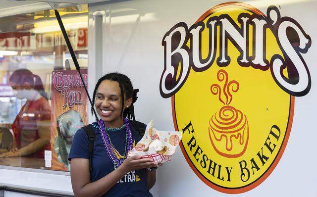 Jazsmin Taylor takes a photo with her Buni's Bakery cinnamon roll sundae during the opening day of the 74th annual Miami-Dade County Youth Fair on Thursday, March 12, 2026, in Miami, Fla.