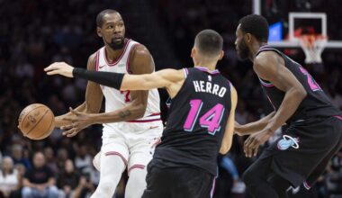 Houston Rockets forward Kevin Durant (7) looks to pass the ball as Miami Heat guard Tyler Herro (14) and forward Andrew Wiggins (22) defend in the first half of their NBA game at Kaseya Center on Saturday, Feb. 28, 2026, in Miami.