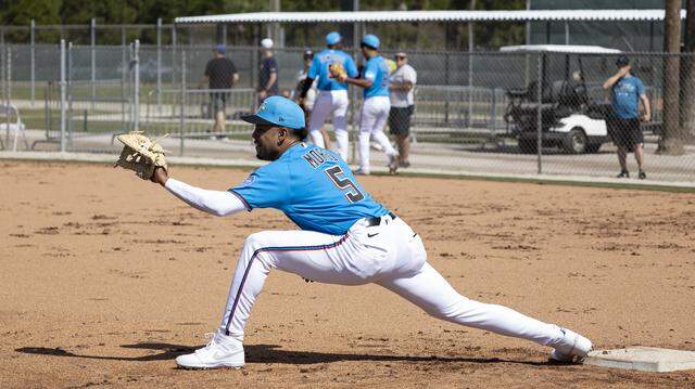 Miami Marlins utility player Christopher Morel (5) catches the ball during the team's first full-squad spring training workout at Roger Dean Stadium on Monday, Feb. 16, 2026, in Jupiter, Fla.