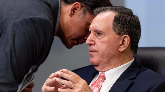 Commissioner Joe Carollo listens to an aide during a Miami City Commission meeting on Tuesday, June 17, 2025.