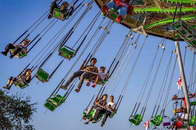Fairgoers enjoy a ride during the first day of the Miami-Dade County Fair & Exposition in this file photo from March 13, 2025.