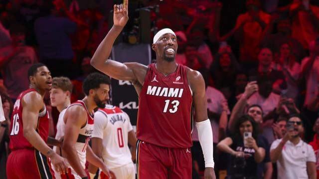 Miami Heat center Bam Adebayo (13) reacts after becoming the second highest scorer for points per game in NBA history during the second half of a basketball game against the Washington Wizards on Tuesday, March 10, 2026, at Kaseya Center in downtown Miami, Fla. The Miami Heat won 150-129. 