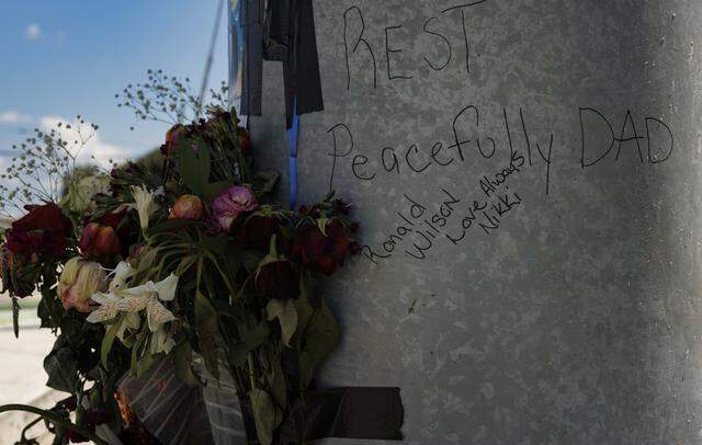 A memorial for Ronald Wilson sits on display on Thursday, March 26, 2026, at the crash site where Wilson, a bystander during a cop chase involving BSO deputies, was killed at the corner of Prospect Rd. and NW 31st Ave in Fort Lauderdale, Fla.