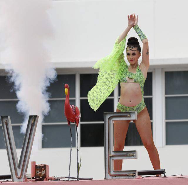 A dancer entertains people on Ocean Drive on Saturday, March 14, 2026 in Miami Beach. 
