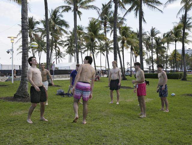 A group of young men play ball in Lummus Park on Saturday, March 14, 2026 in Miami Beach. 