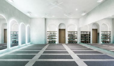 rendering of a yoga studio with rows of mats on the floor and domed mirrors on the left