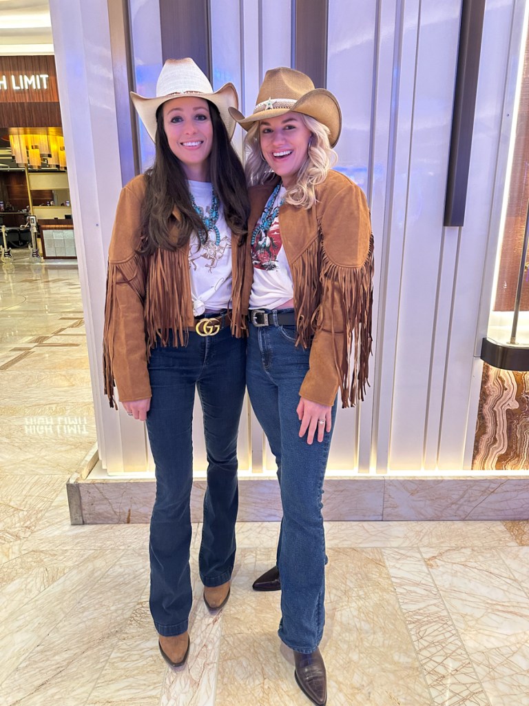 Photo of two concertgoers dressed as cowgirls at the Miranda Lambert show in Miami 2026