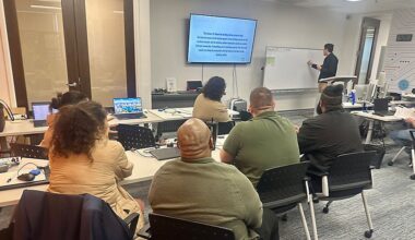 Students sit in classroom learning about IT. (Spectrum News)