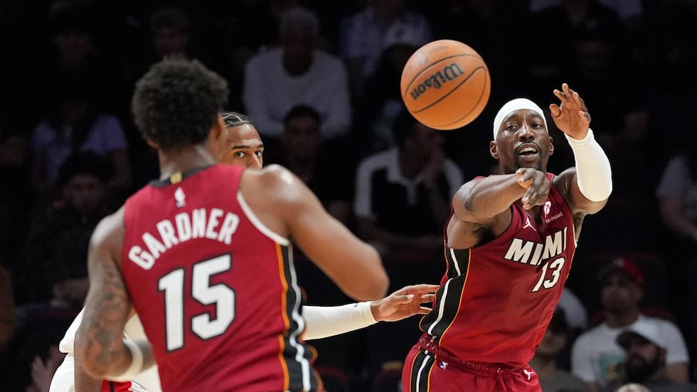 Miami Heat center Bam Adebayo (13) passes to forward Myron Gardner (15) as Washington Wizards...
