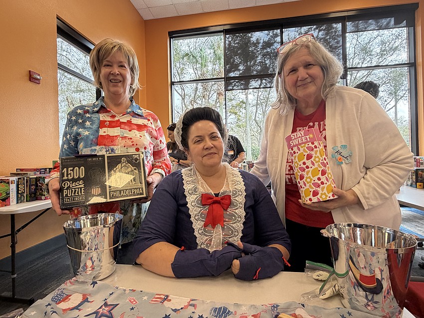 Barbara Barnhill, Marcea Oetting, who dressed as Abigail Adams, and Rhonda Camen celebrated Central Florida Puzzles' 250th puzzle swap Sunday, Feb. 22, at West Oaks Branch Library. In honor of the 250th swap, the theme was Presidents’ Day.