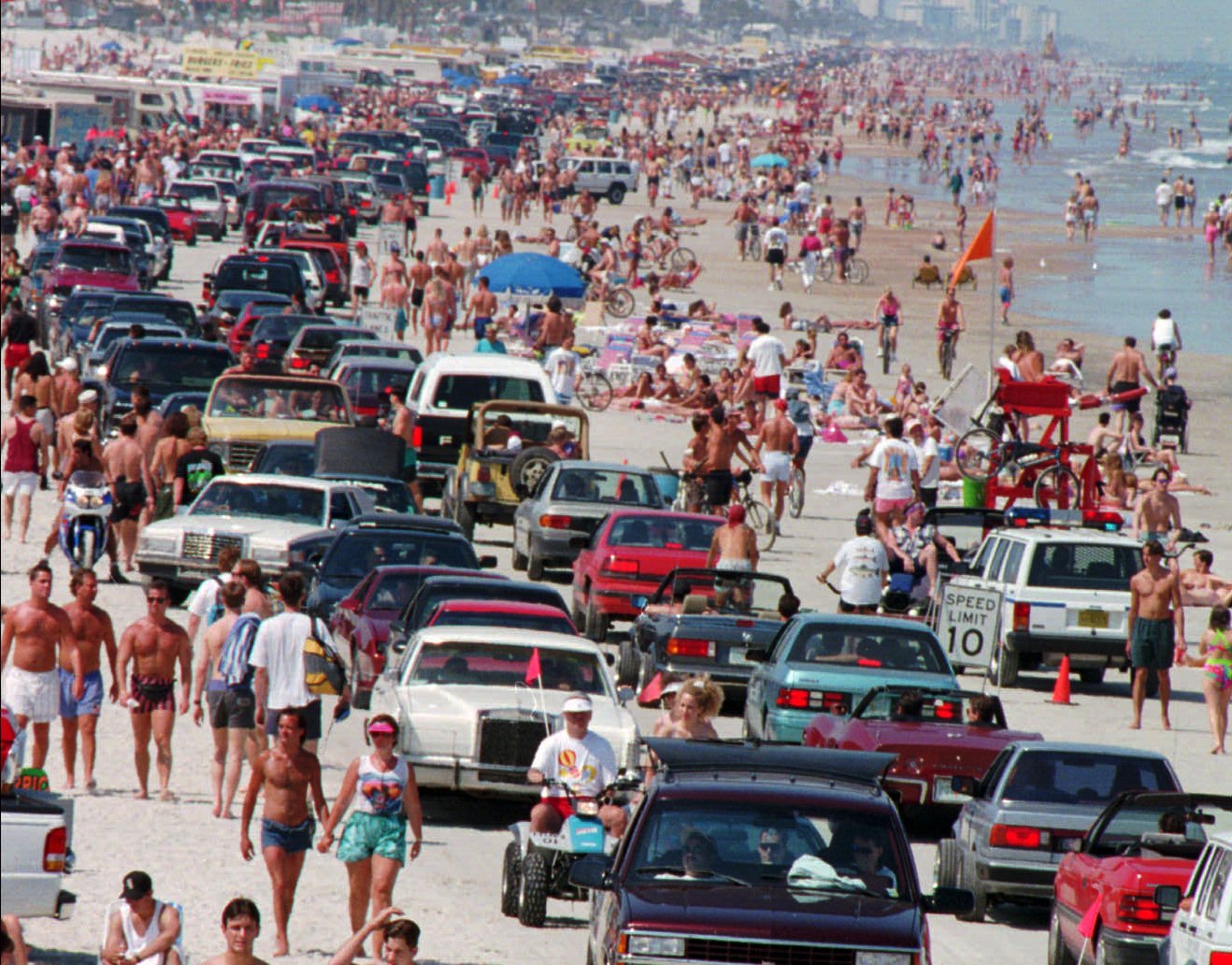 Spring breakers and their cars crowd Daytona's famous beach Sunday,...