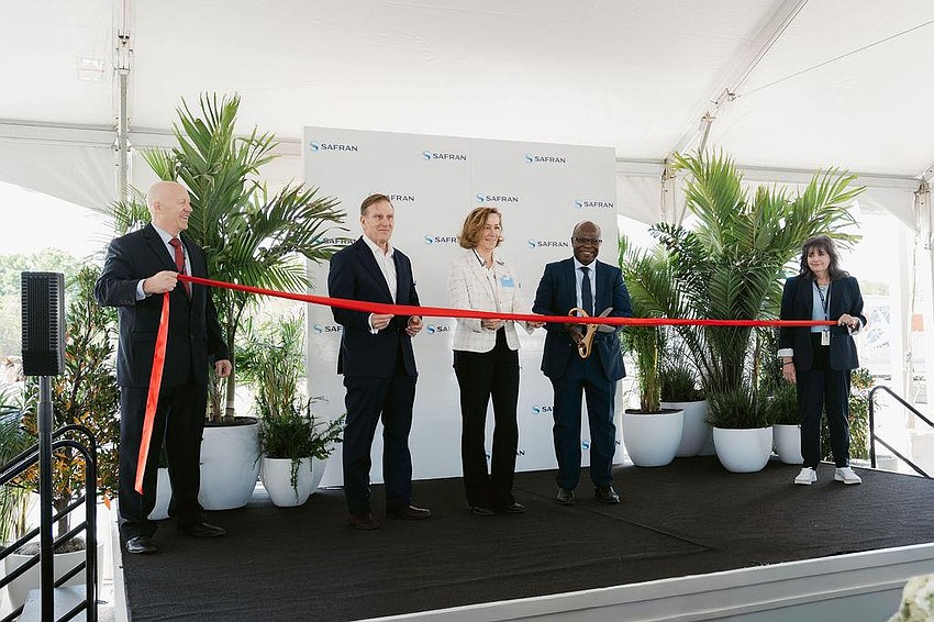 Executives cut the ribbon at the expanded Safran Electrical & Power facility in south Manatee County.