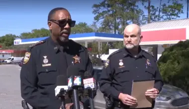 Sheriff T.K. Waters and Undersheriff Shawn Coarsey on the street, where police shot a man with a gun.