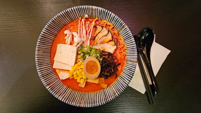 A bowl of colorful spicy creamy mushroom ramen