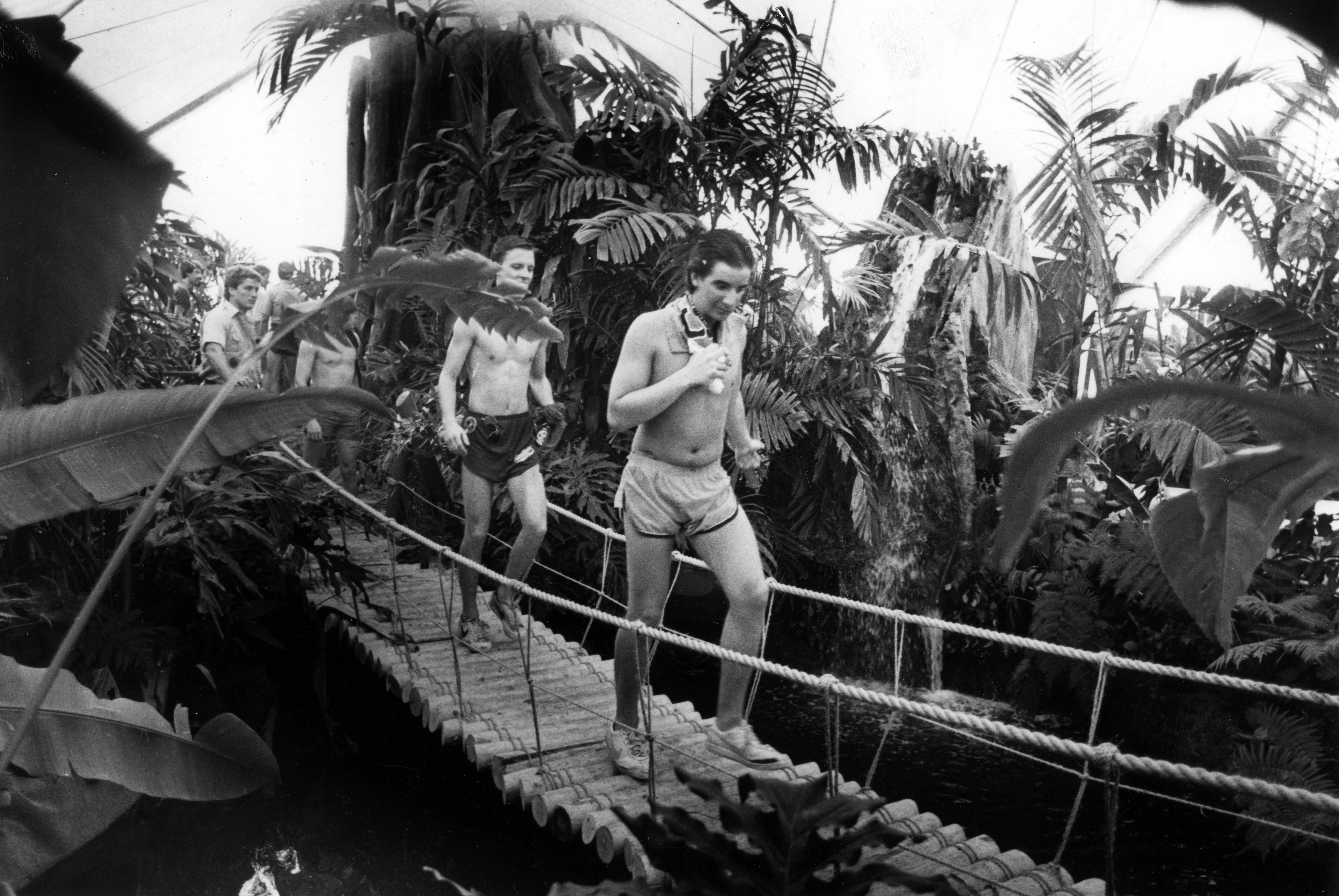 Joe Smardt and Steve Portan of Indiana, cross a swinging...