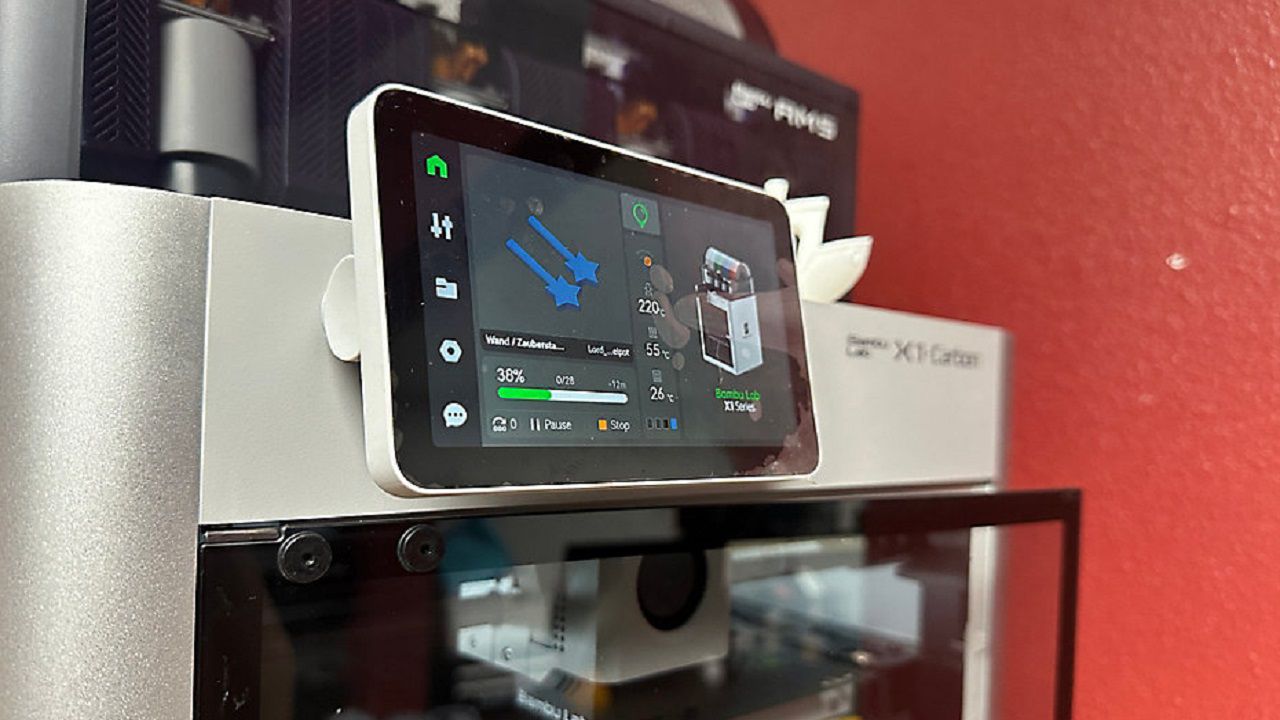 A 3D printer works to create a keychain at the TASCO Center for Teen Technology (Angie Angers).