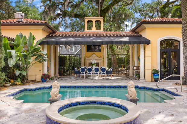The estate at 1400 Alabama Drive in Winter Park features a private courtyard with heated pool and spa, covered dining area, an outdoor grill, a wood-burning fireplace and multiple terraces. The detached pool house doubles as a catering suite with prep sink, refrigerator, and wall-to-wall storage. (Image provided by Rachel Peters)