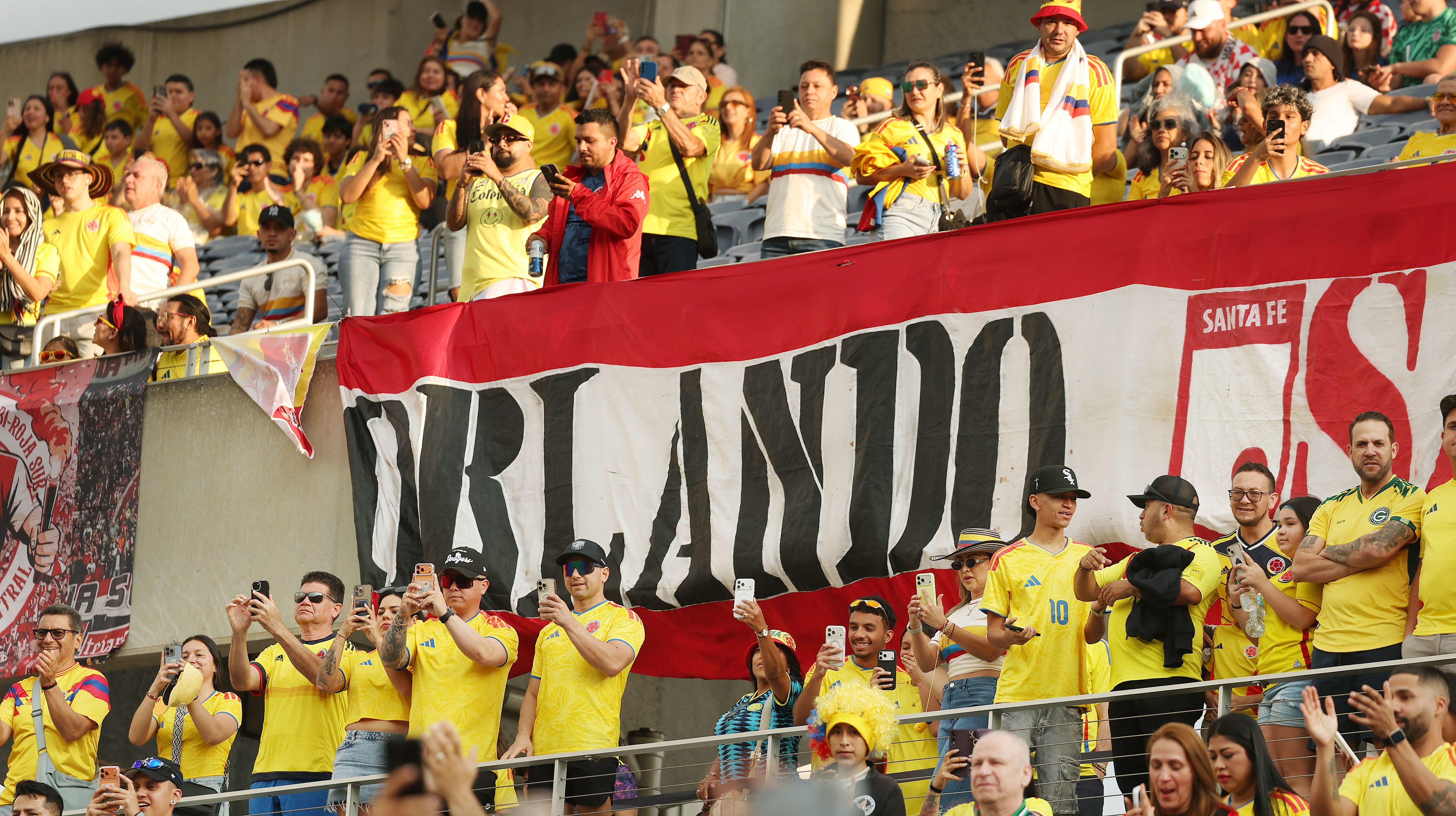 Fans cheer during the Road to 26 FIFA Match of...