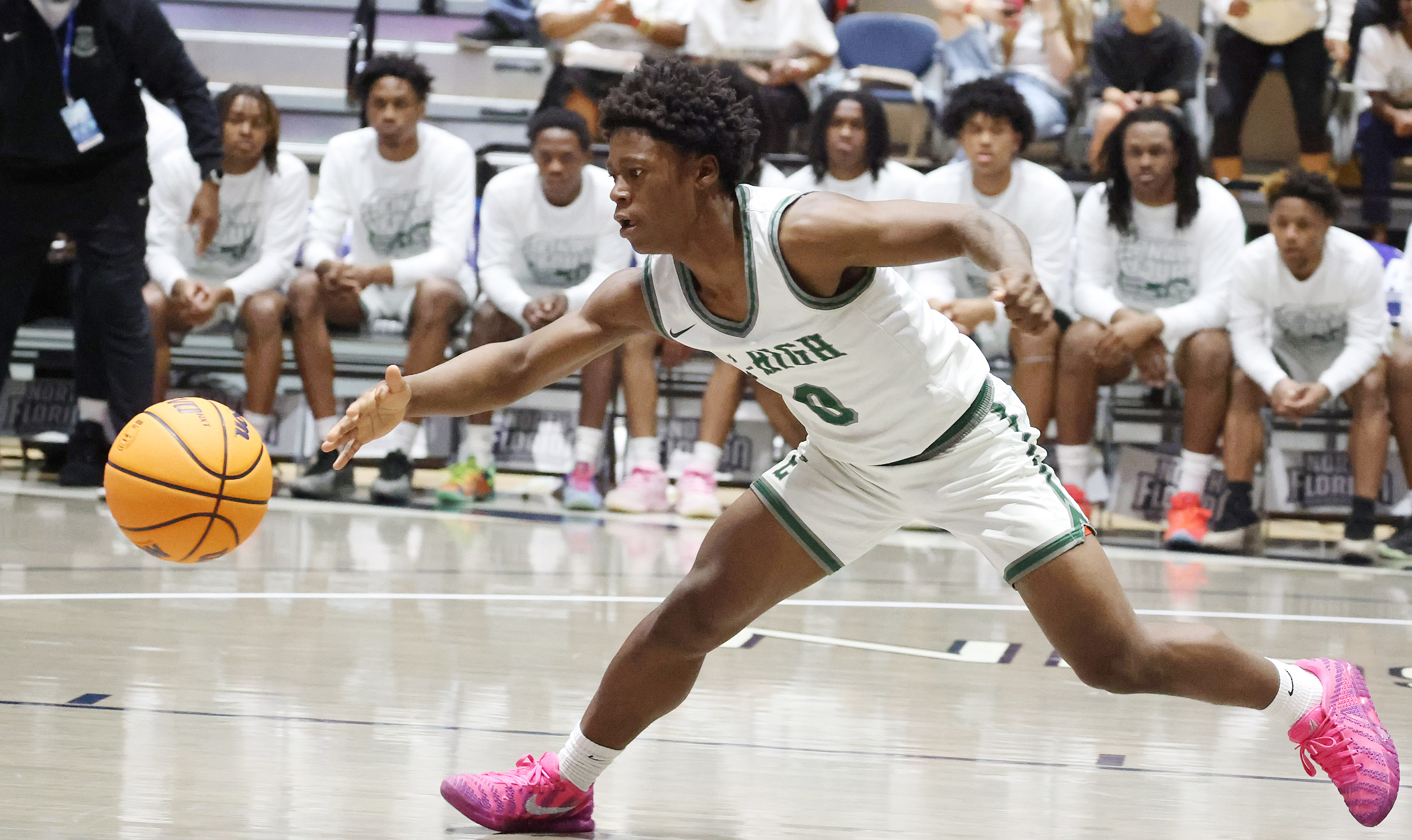 Evans guard Kadir Rackley chases a loose ball during the...