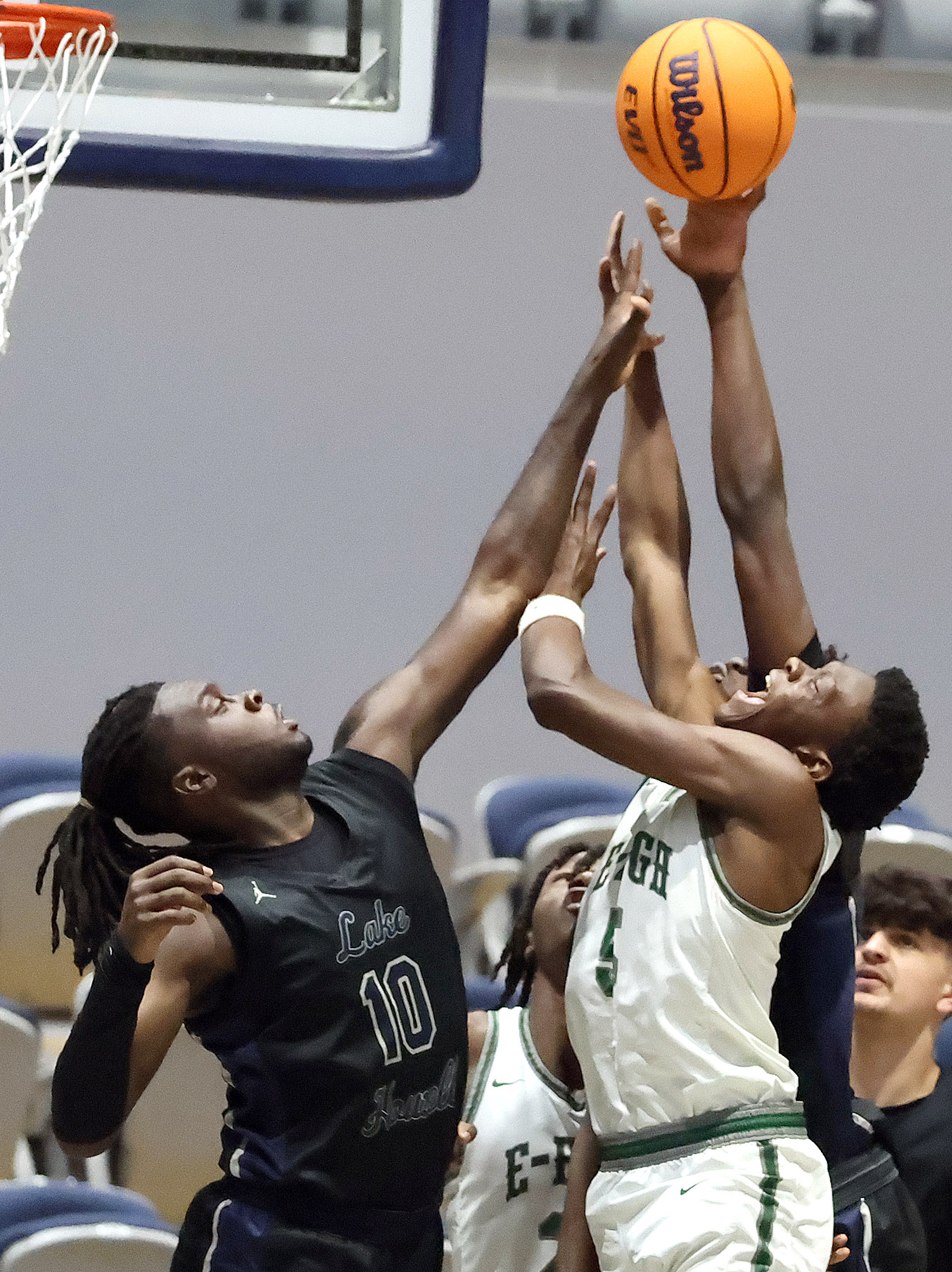 Lake Howell player Isaac Buckley (10) blocks the shot of...