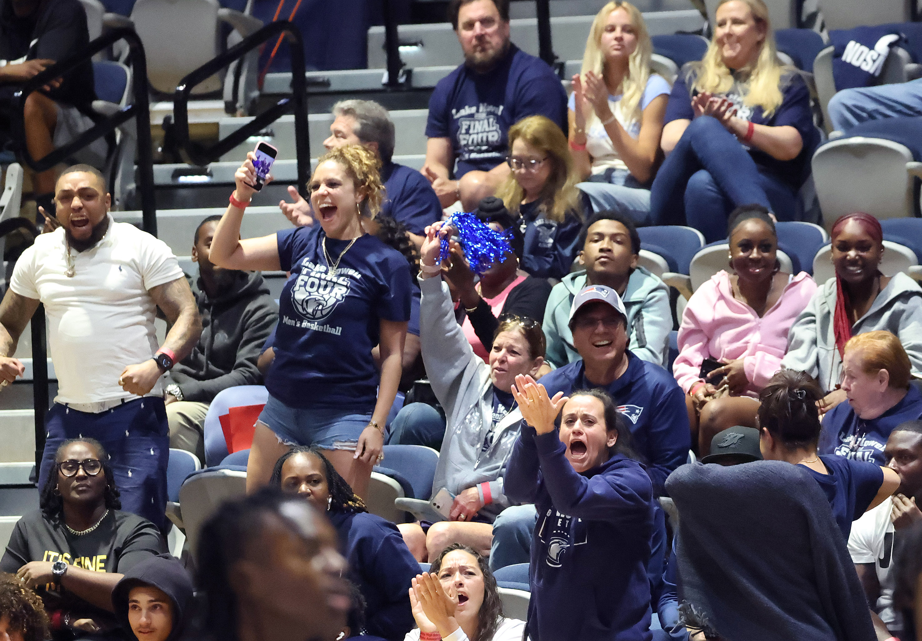 Fans cheer during the Lake Howell versus Evans Class 6A...