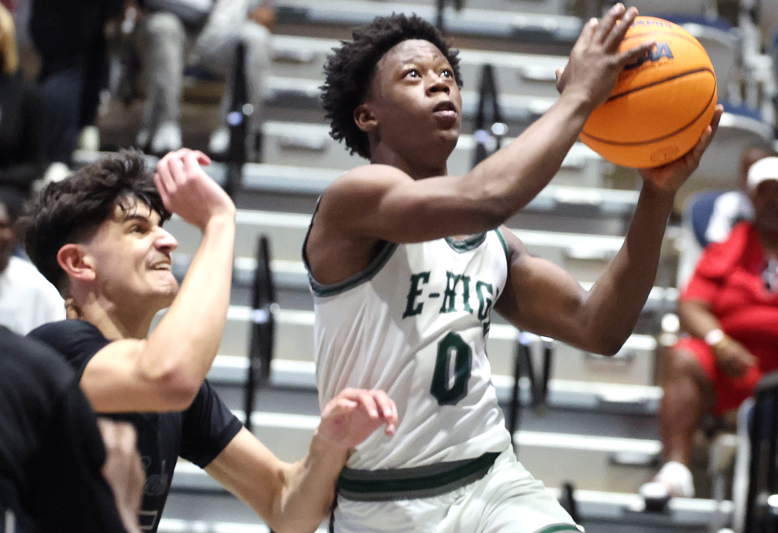 Evans guard Kadir Rackley (0) scores during the Lake Howell...