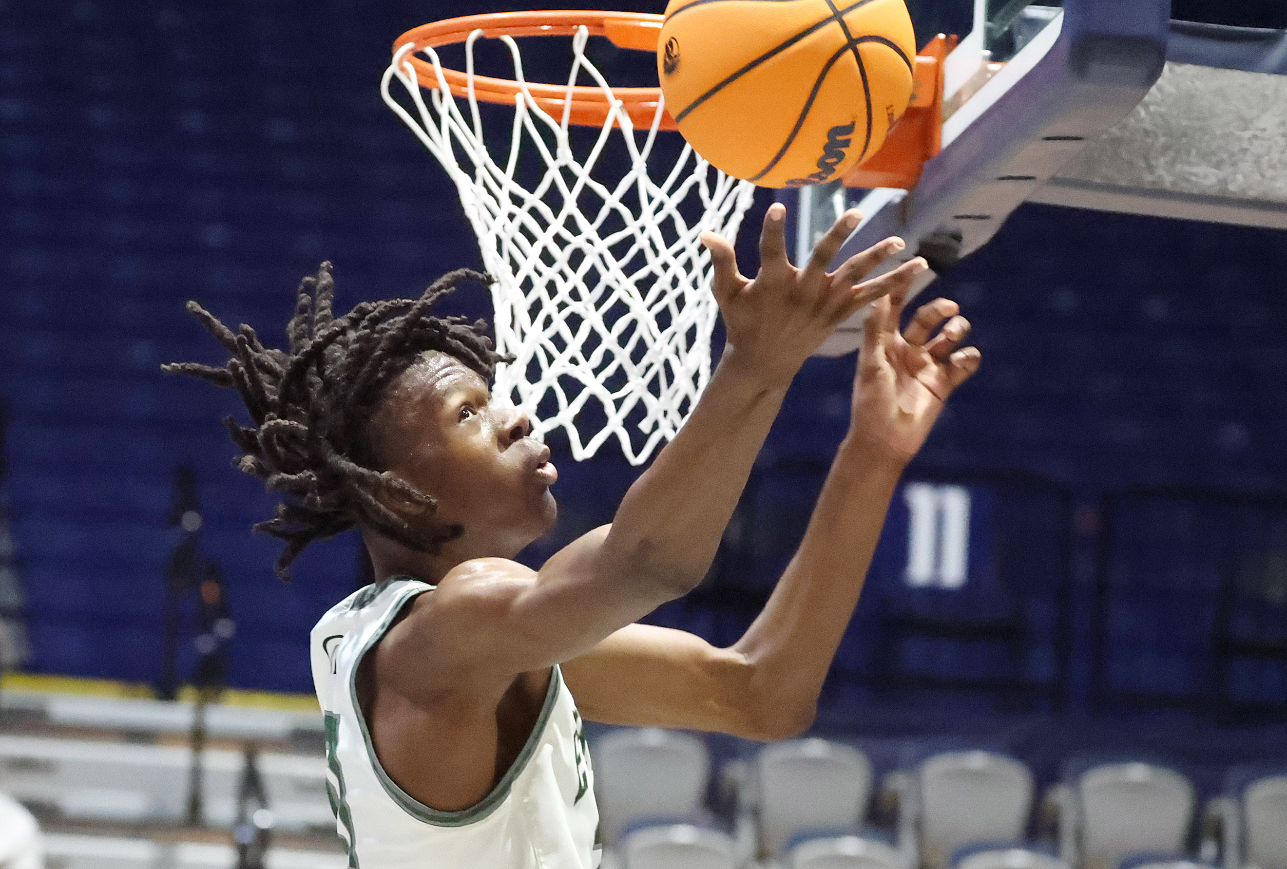 Evans player Dewayne Dixon pulls in a rebound during the...
