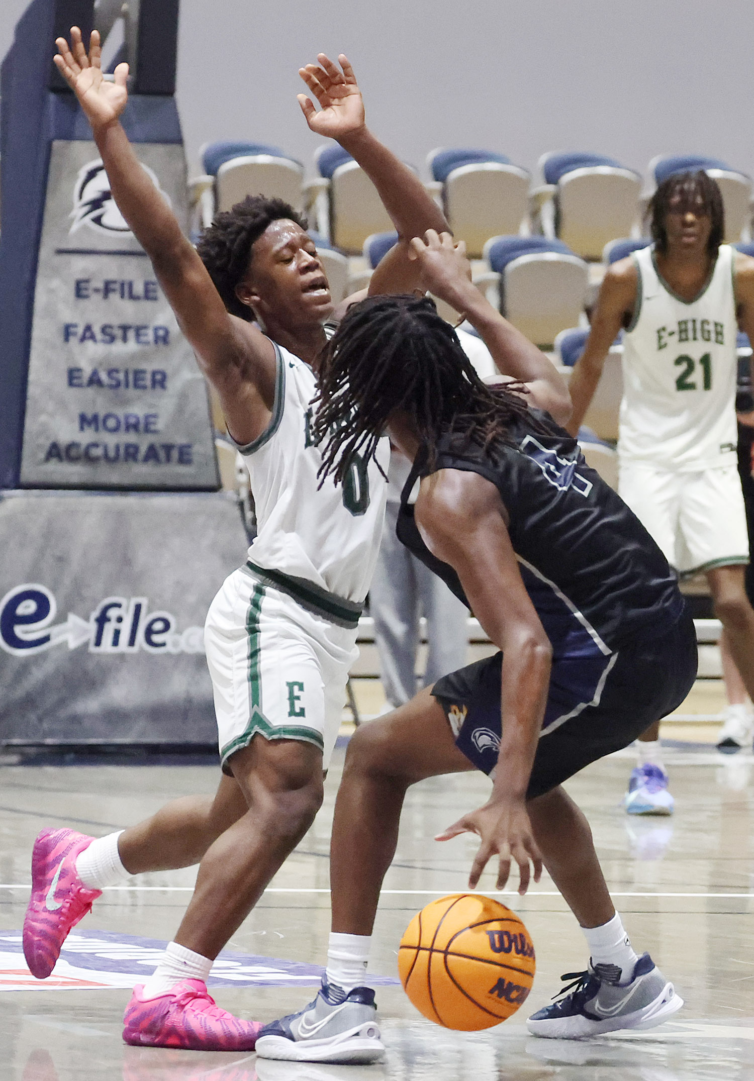 Evans guard Kadir Rackley (0) defends a drive by Lake...