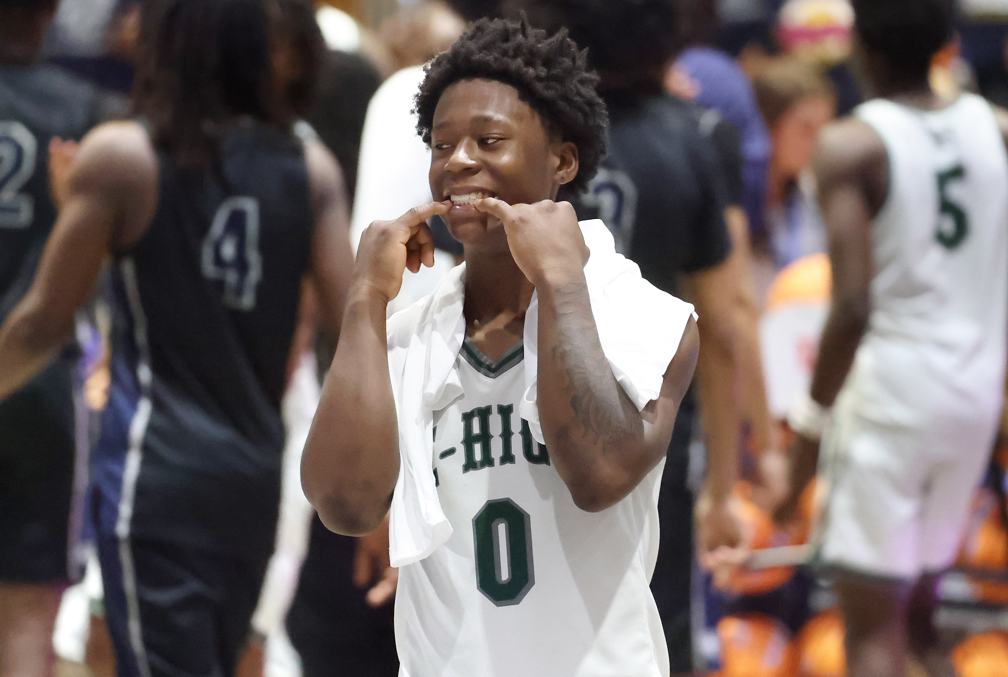 Evans guard Kadir Rackley celebrates after winning the Lake Howell...