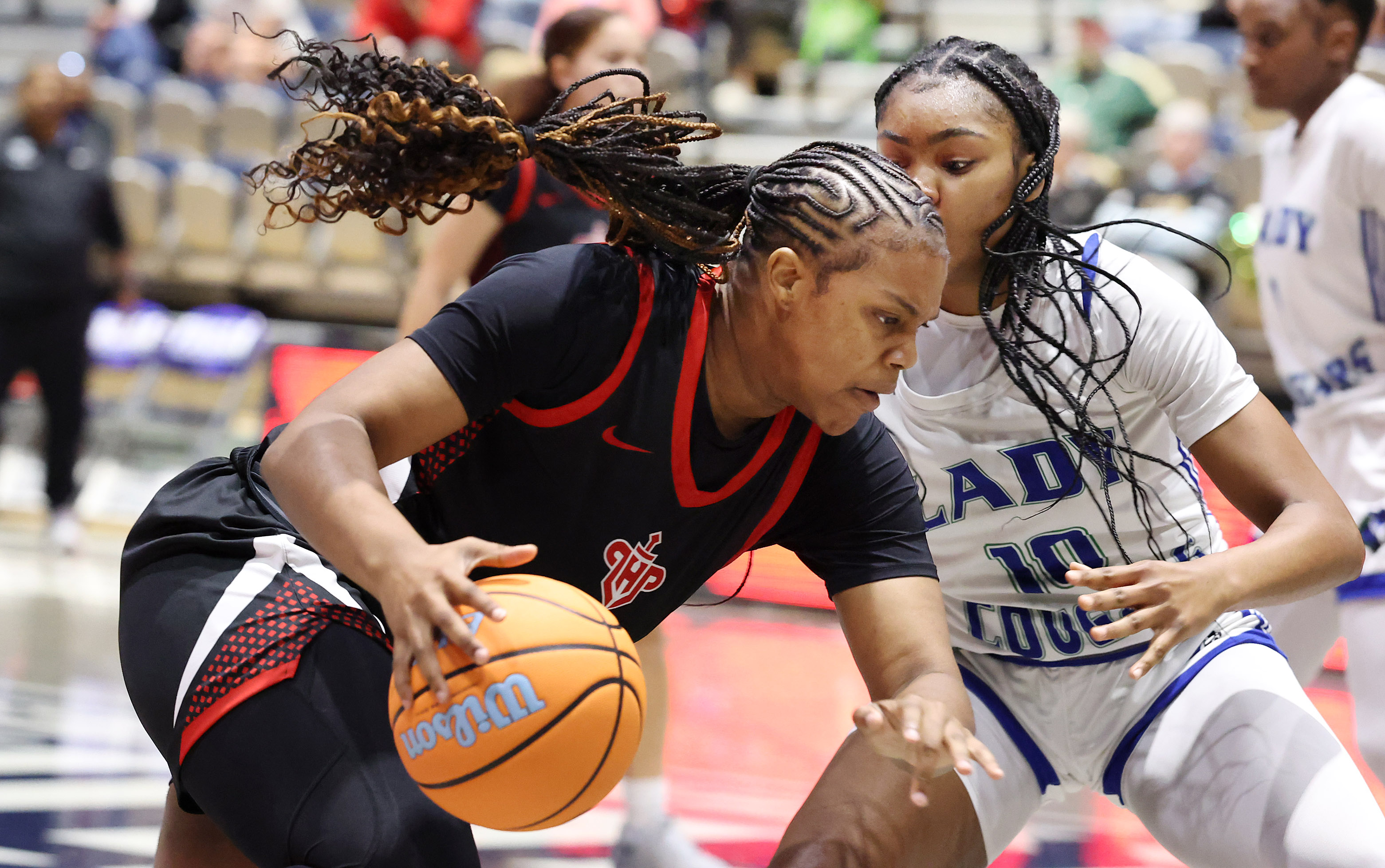 Lake Highland player Aubrey Griffin (with ball) drives during the...