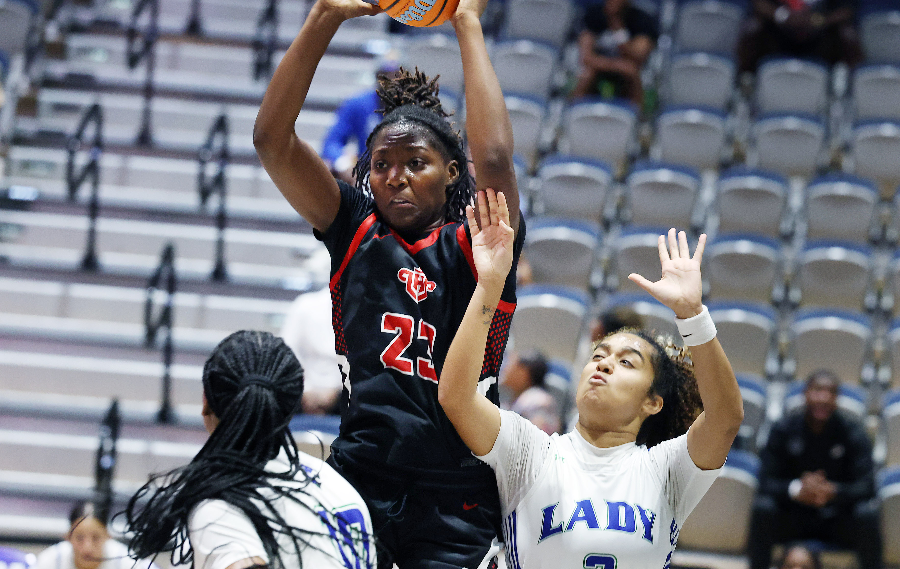 Lake Highland player Saleigh Simpson (23) leaps high for a...