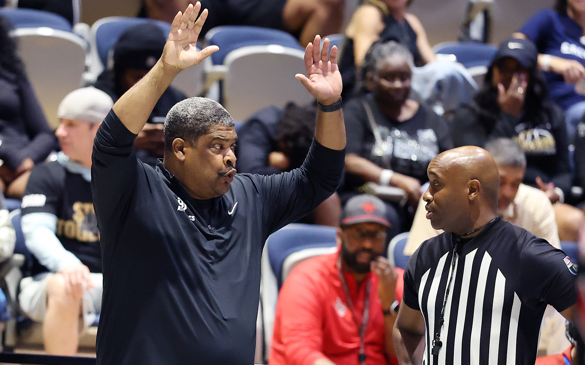 Lake Highland coach Al Honor chats with a game official...
