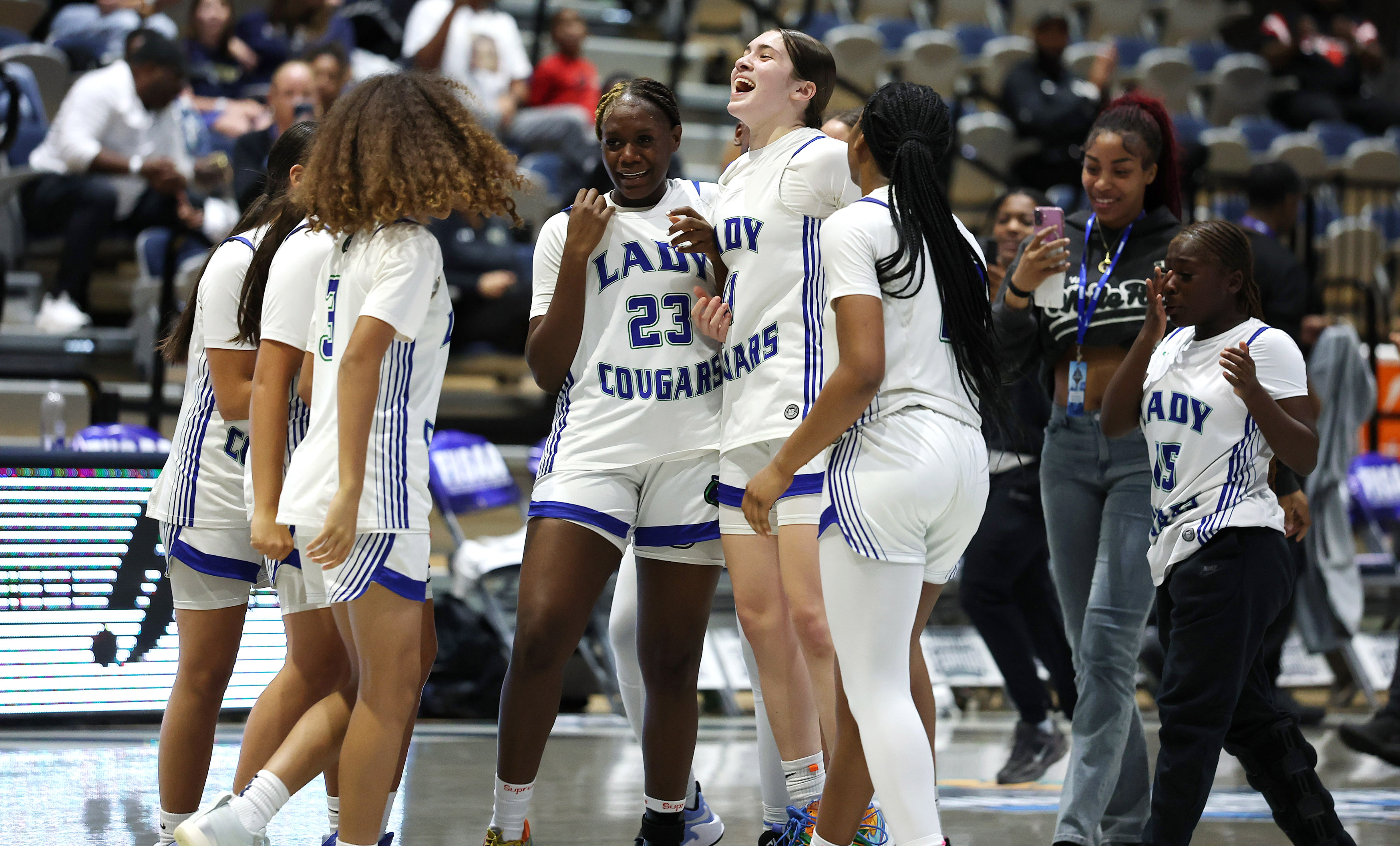 Somerset players celebrate after winning the FHSAA Girls Basketball 3A...