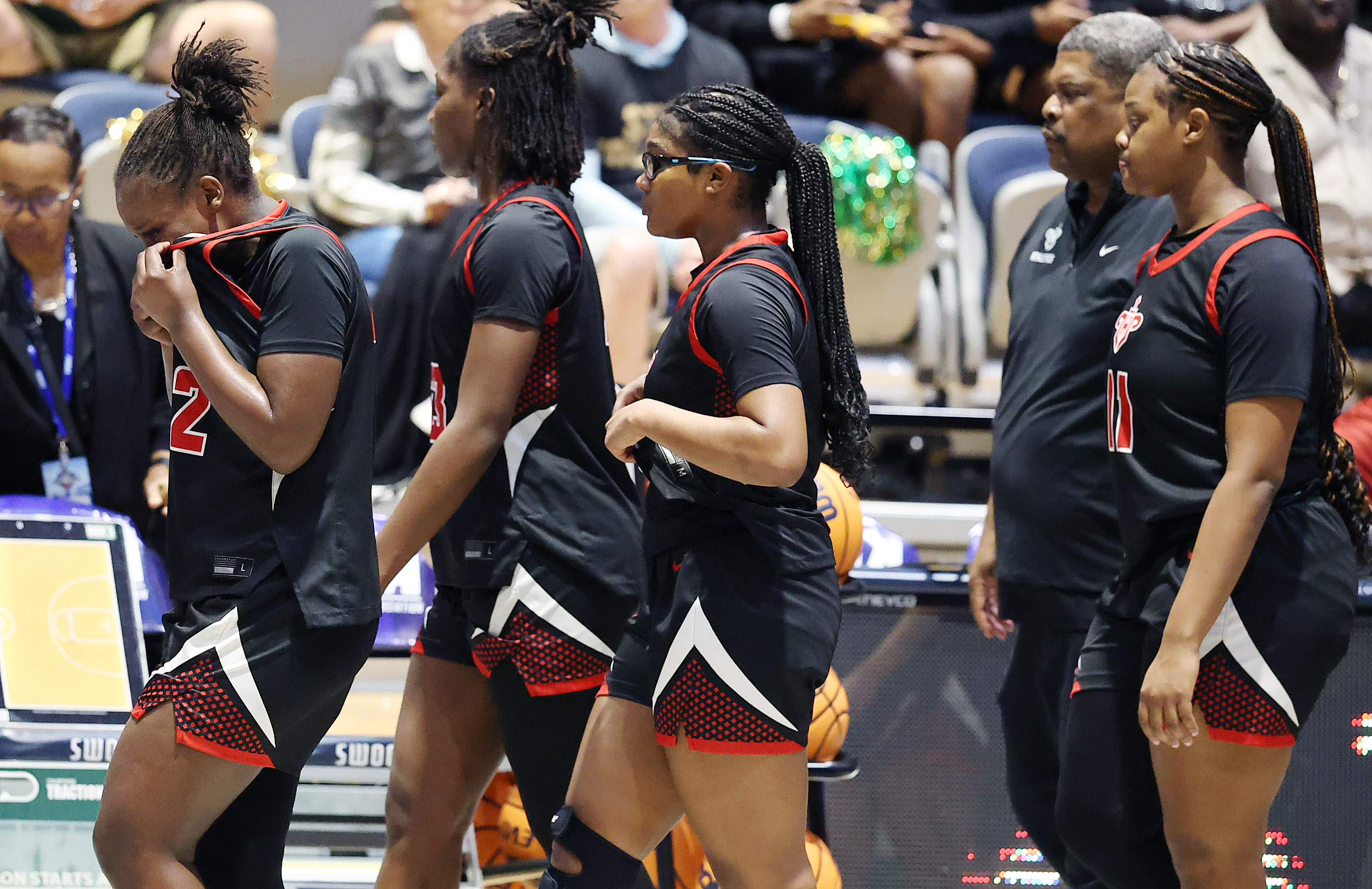 Lake Highland players leave the court after losing the FHSAA...