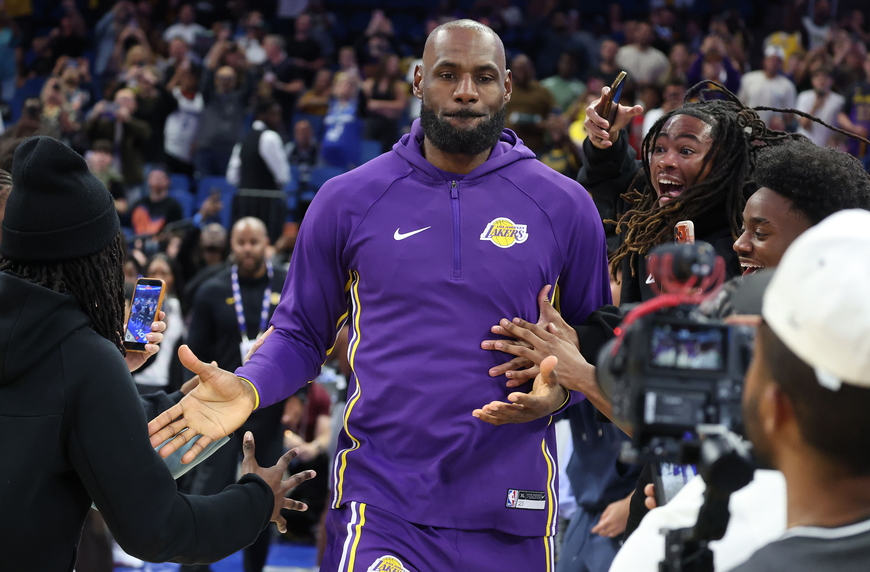 LA forward LeBron James goes onto the court for the...