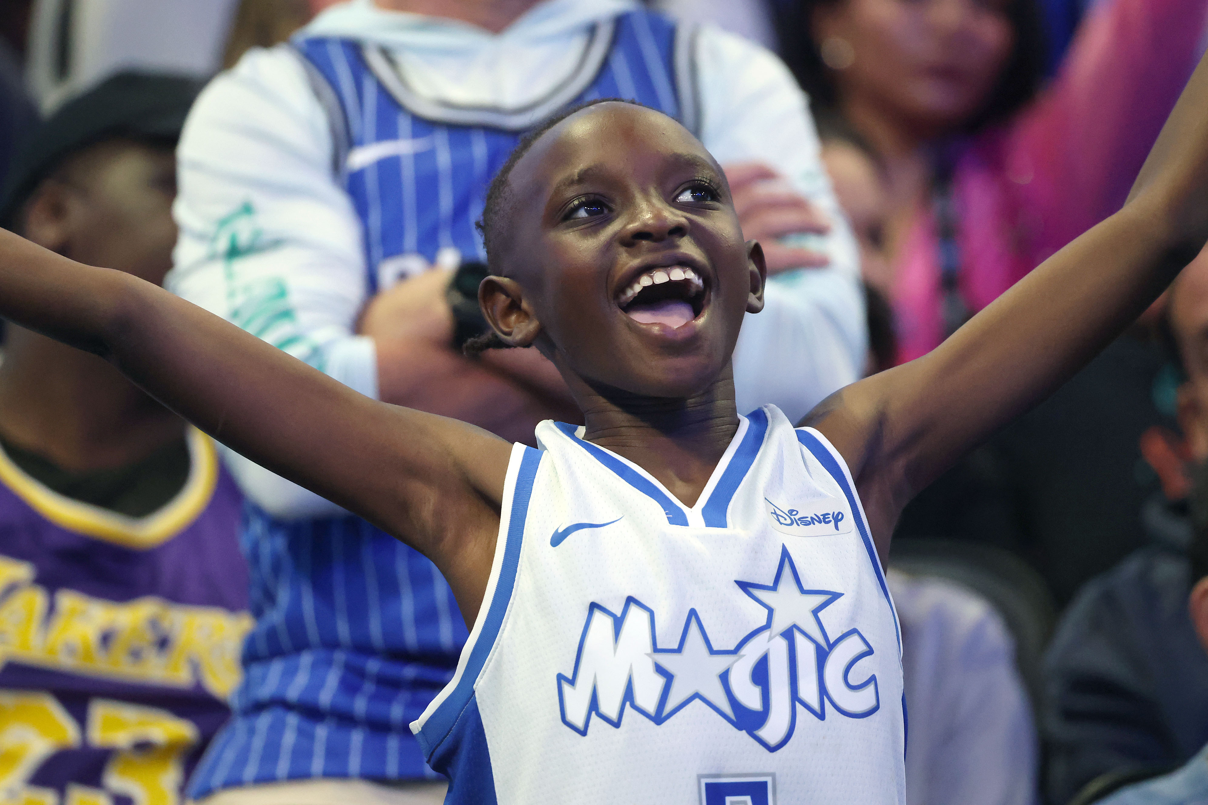 A young Orlando fan cheers during the Los Angeles Lakers...