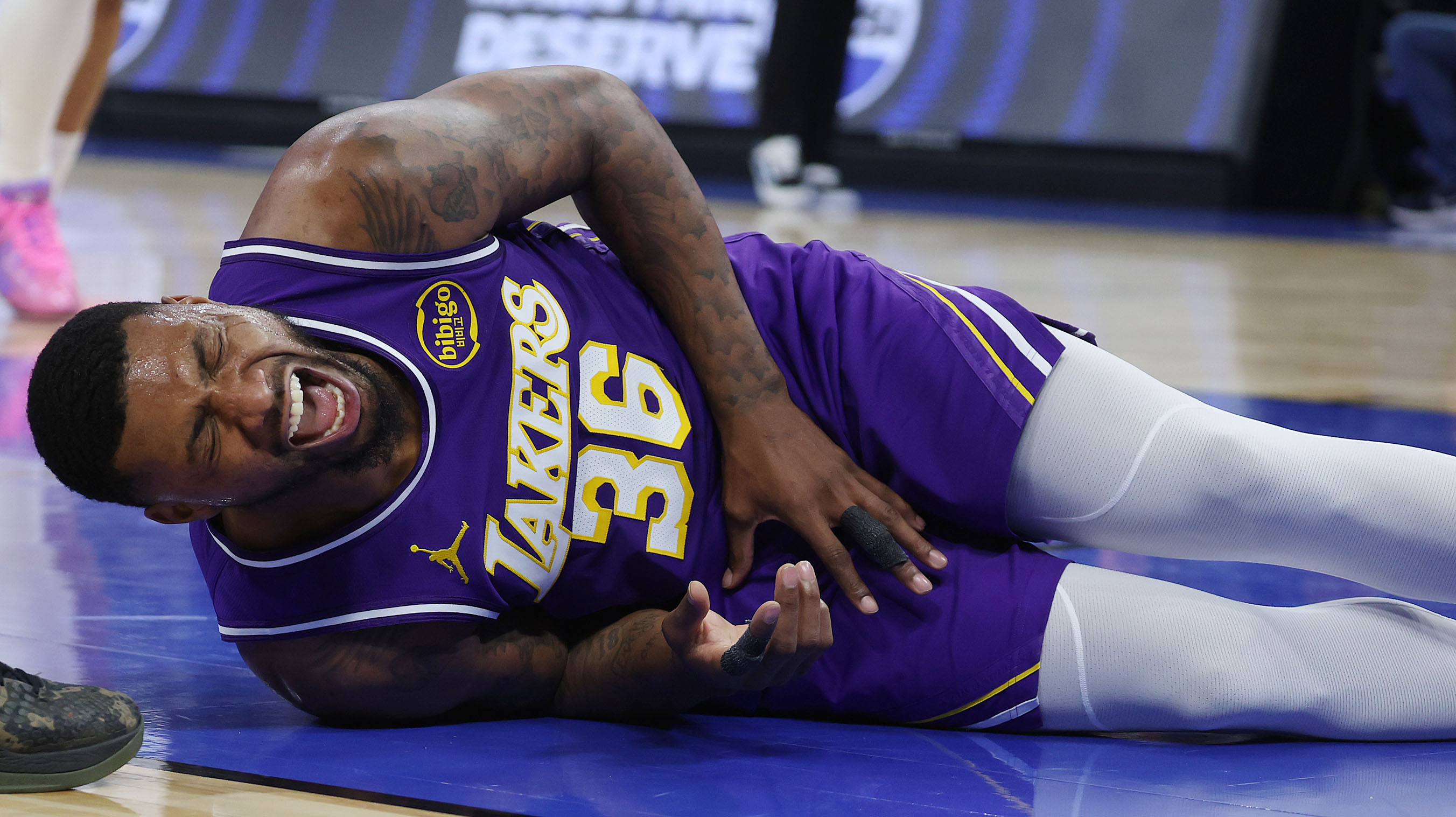 LA forward Marcus Smart yells after falling during the Los...