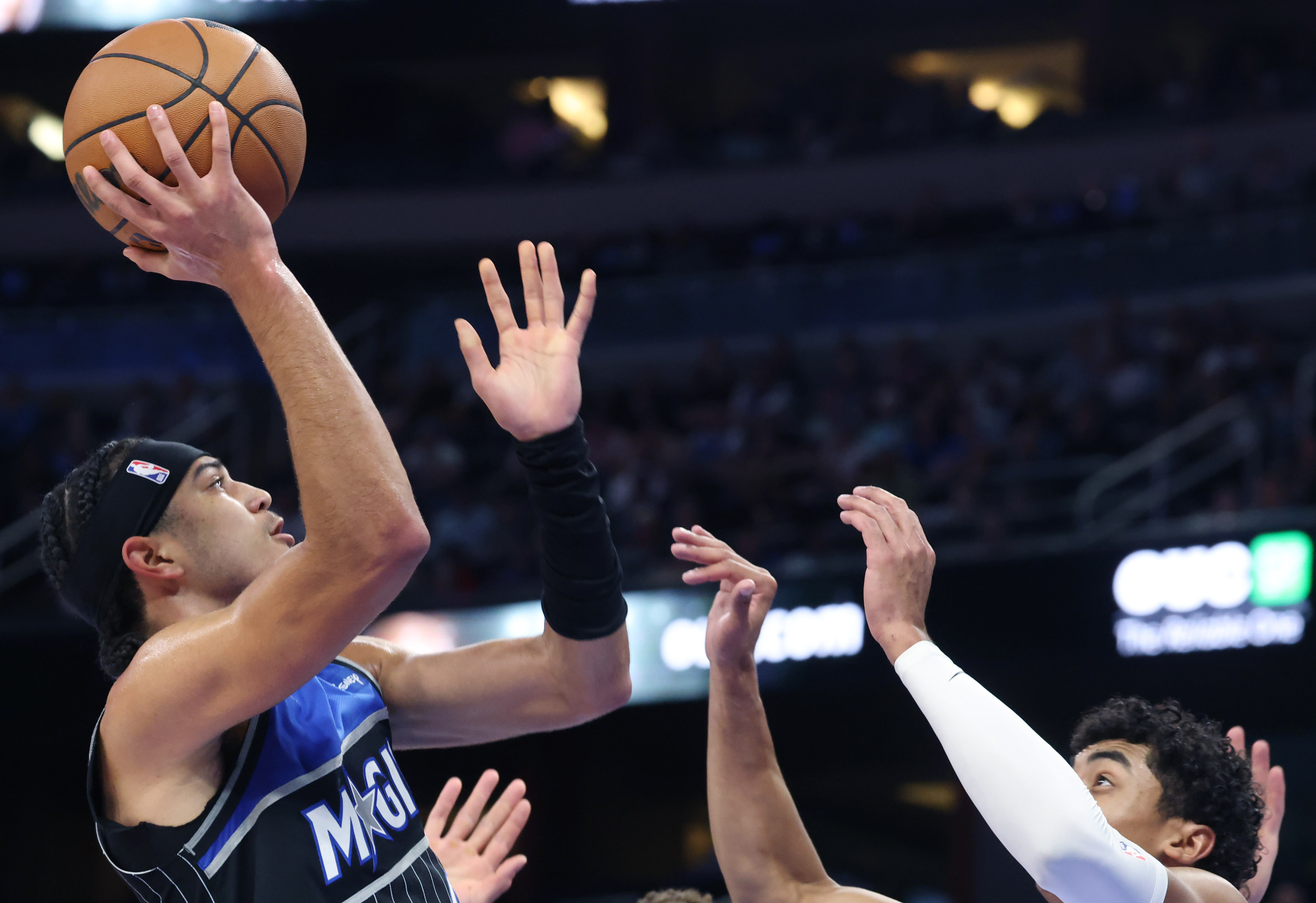 Orlando guard Anthony Black (left) shoots over Dallas guard Max...