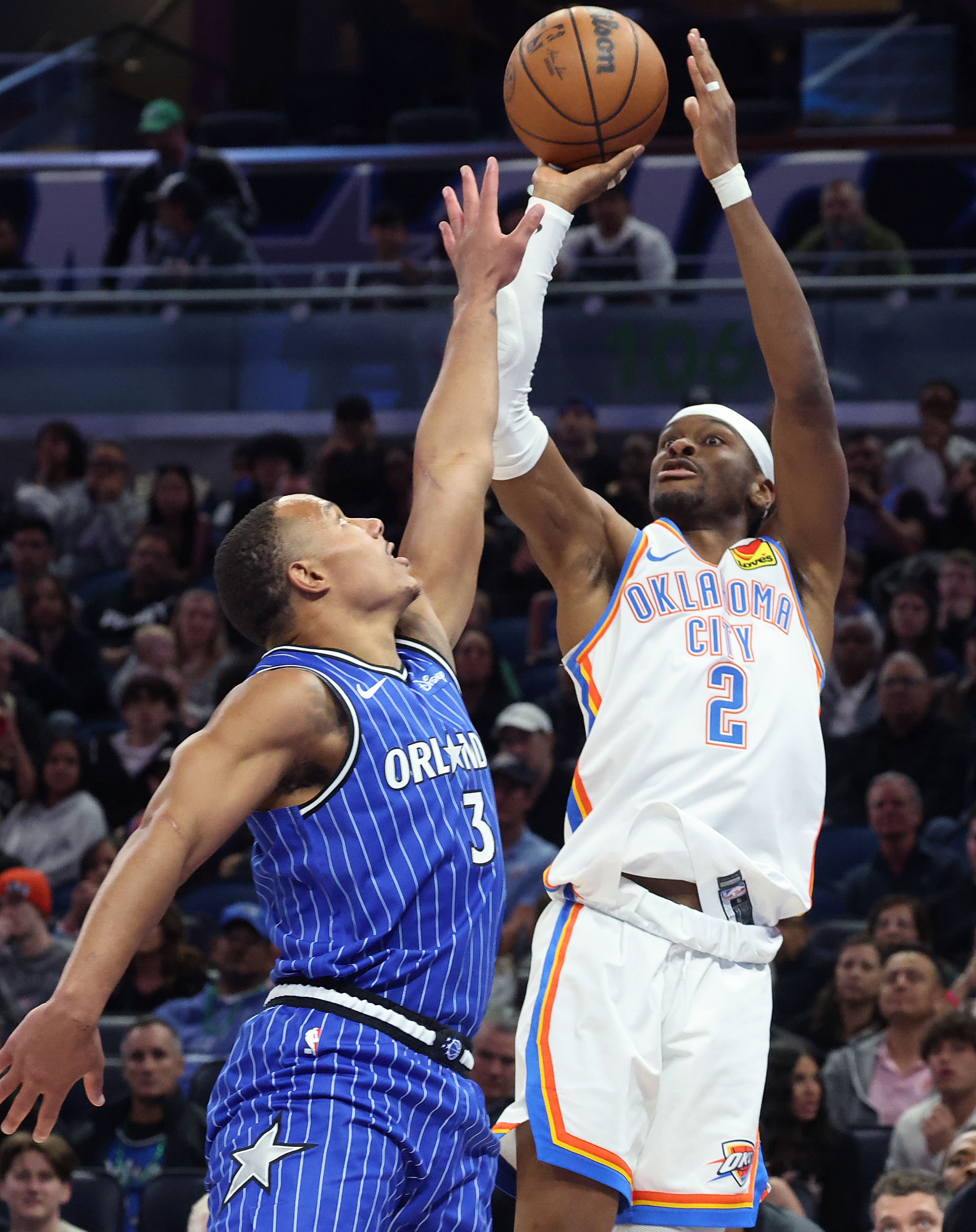 Thunder guard Shai Gilgeous-Alexander (2) shoots over Orlando guard Desmond...
