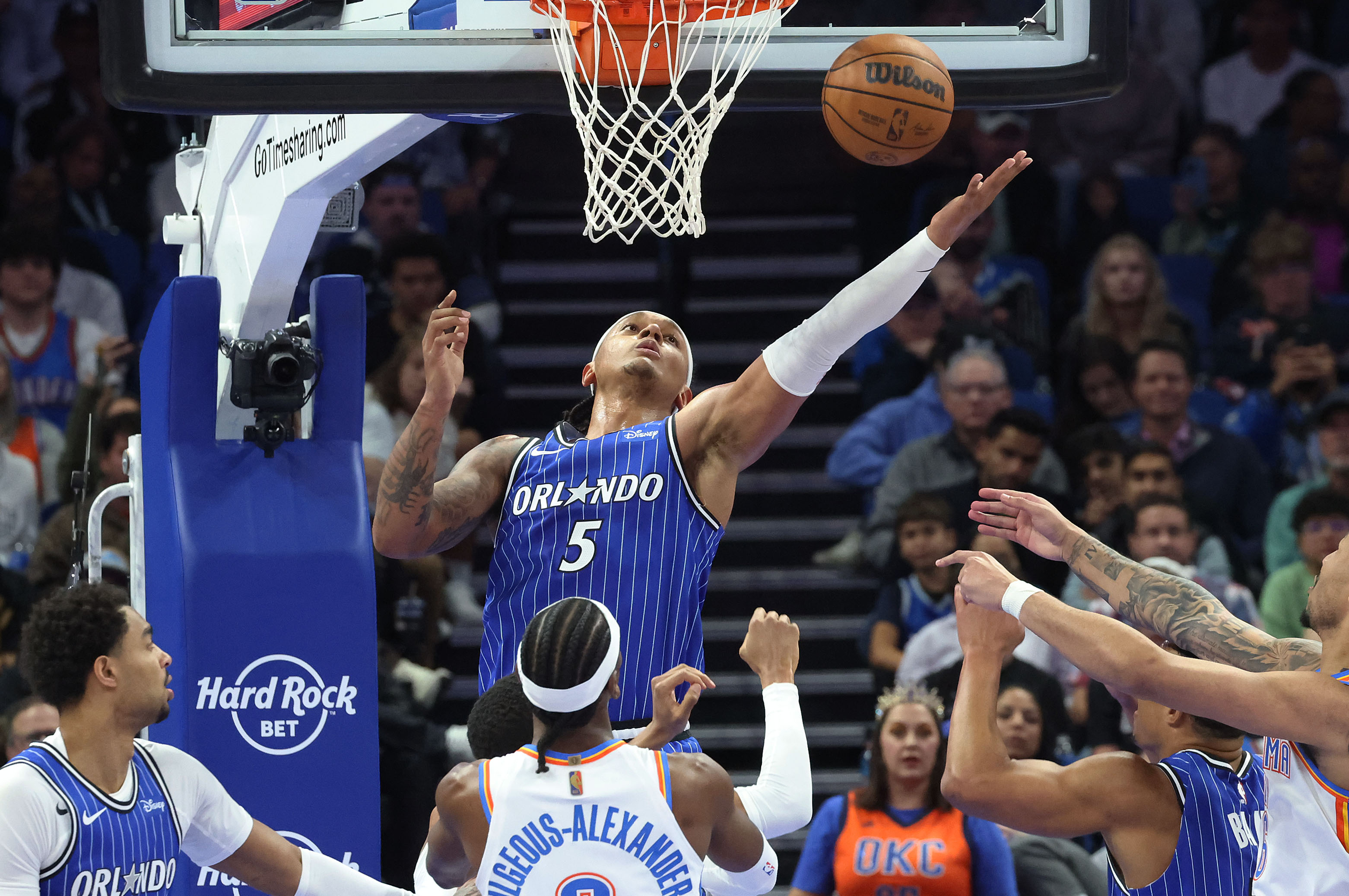 Magic forward Paolo Banchero (5) reaches for a rebound during...