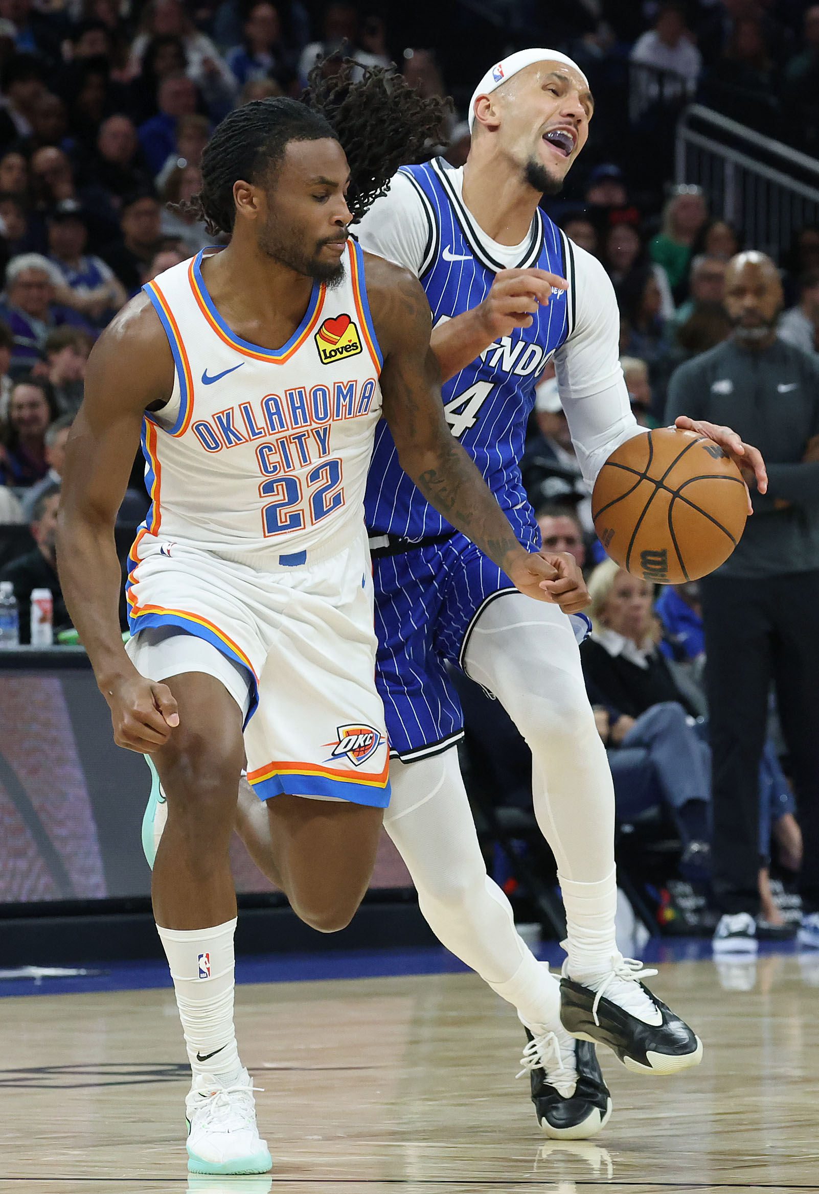 Magic guard Jalen Suggs (4) is fouled by Thunder guard...