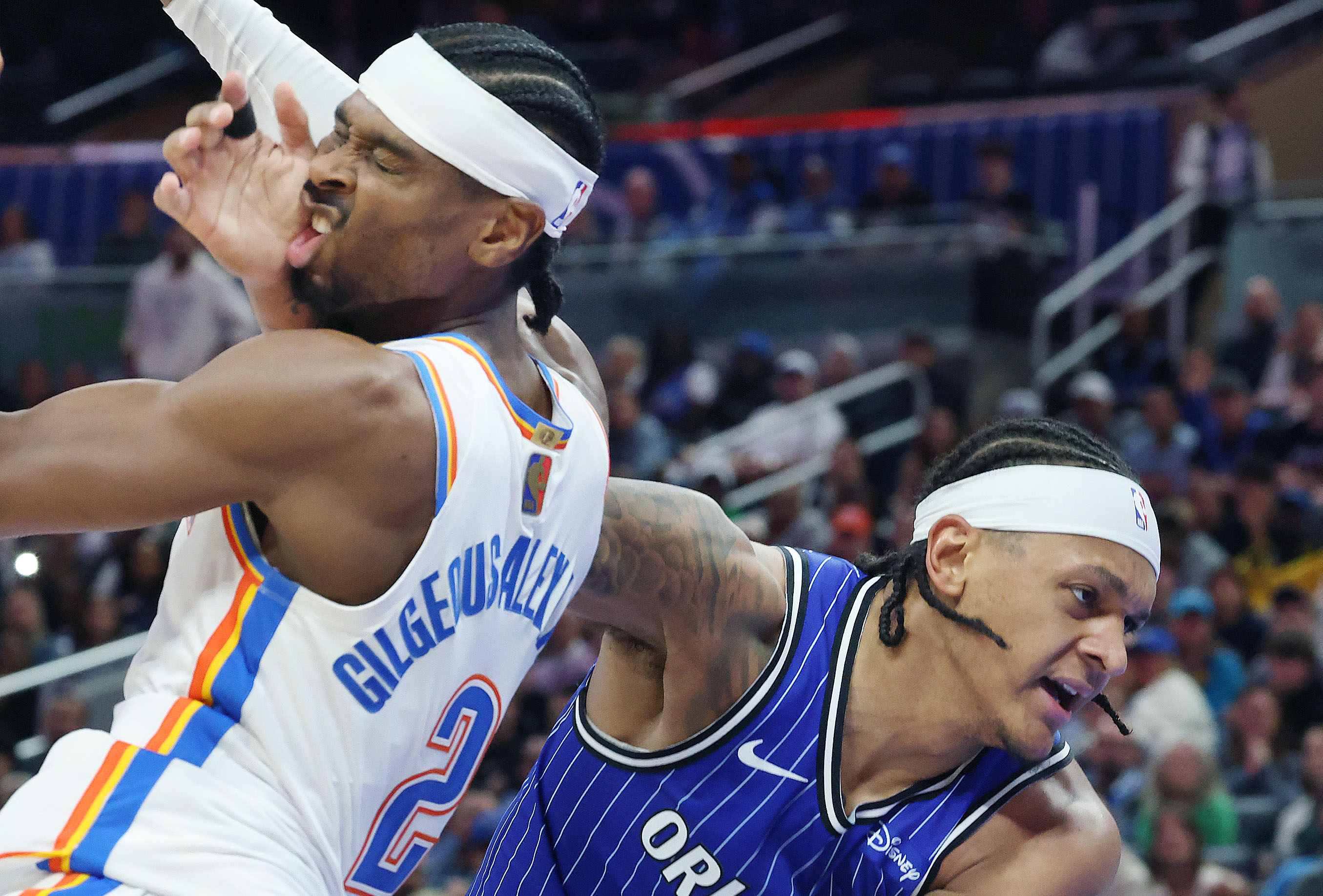 Thunder guard Shai Gilgeous-Alexander (2) gets hit in the face...