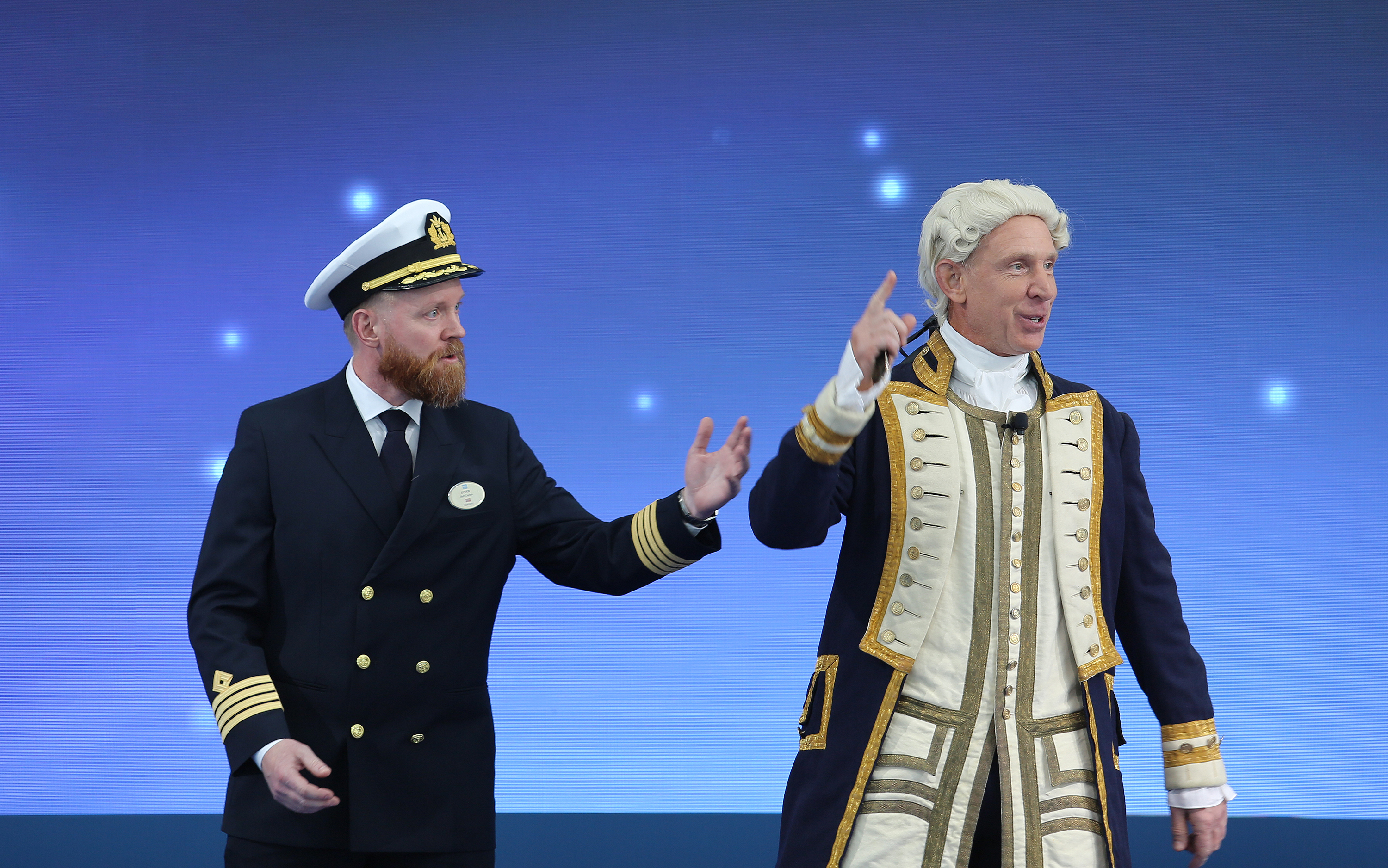 Norwegian Luna Captain Robert Lundberg shares the stage with an...