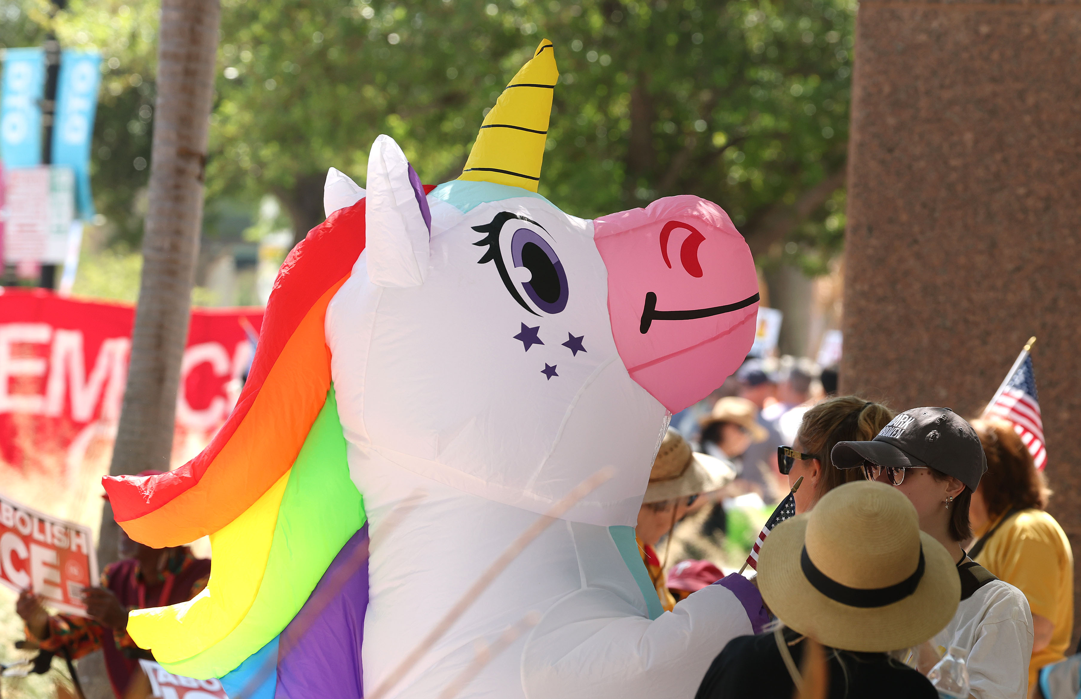 Protestors wear inflatable outfits as they join thousands in front...