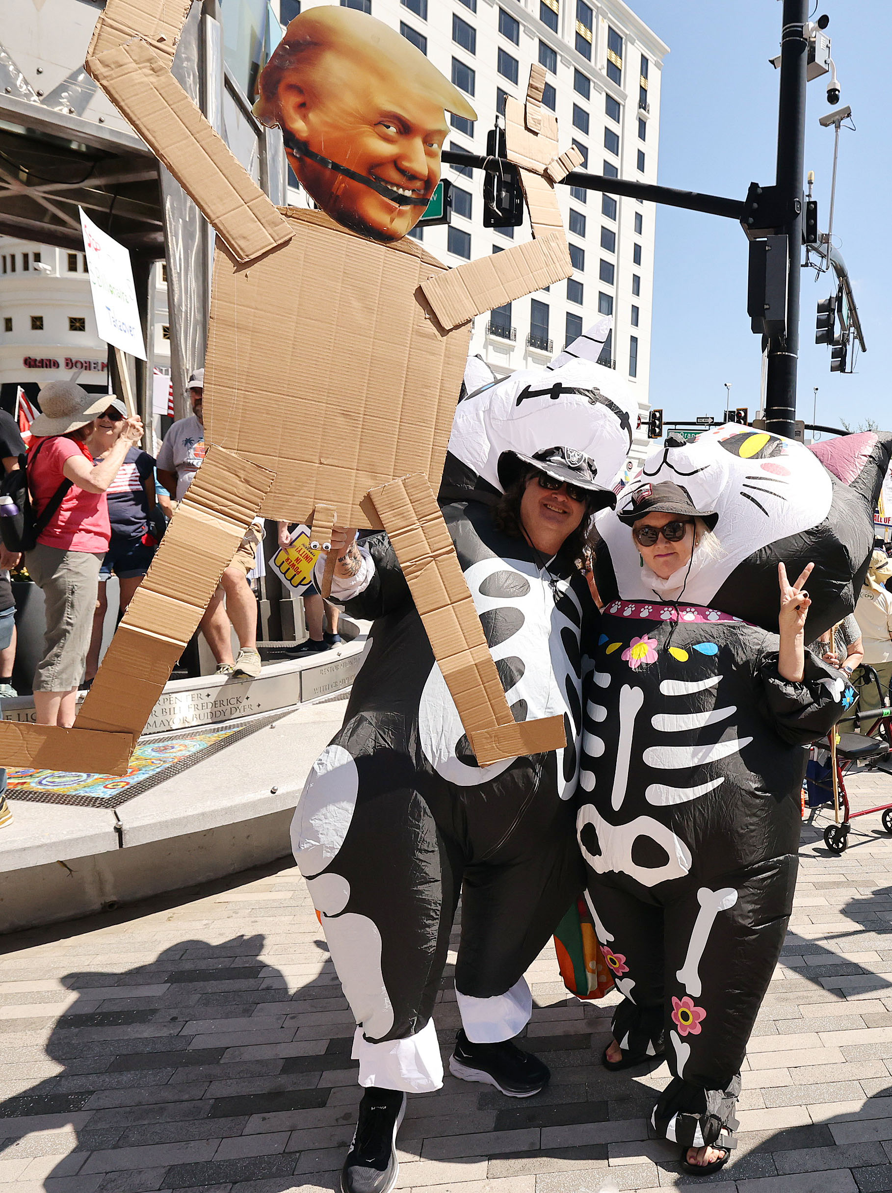 Protestors wear inflatable outfits as they join thousands in front...