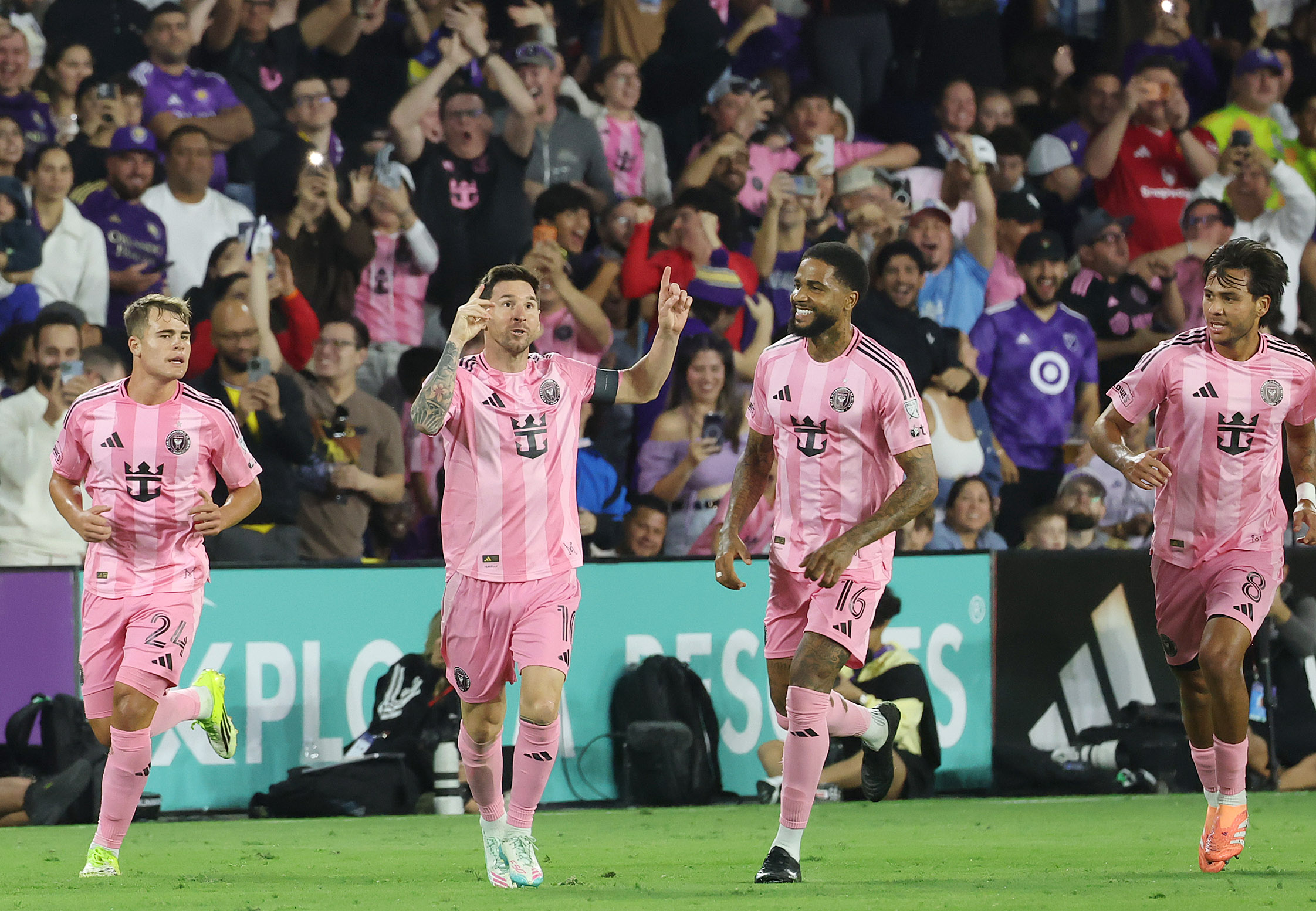 Miami player Lionel Messi (10) celebrates with teammates after scoring...