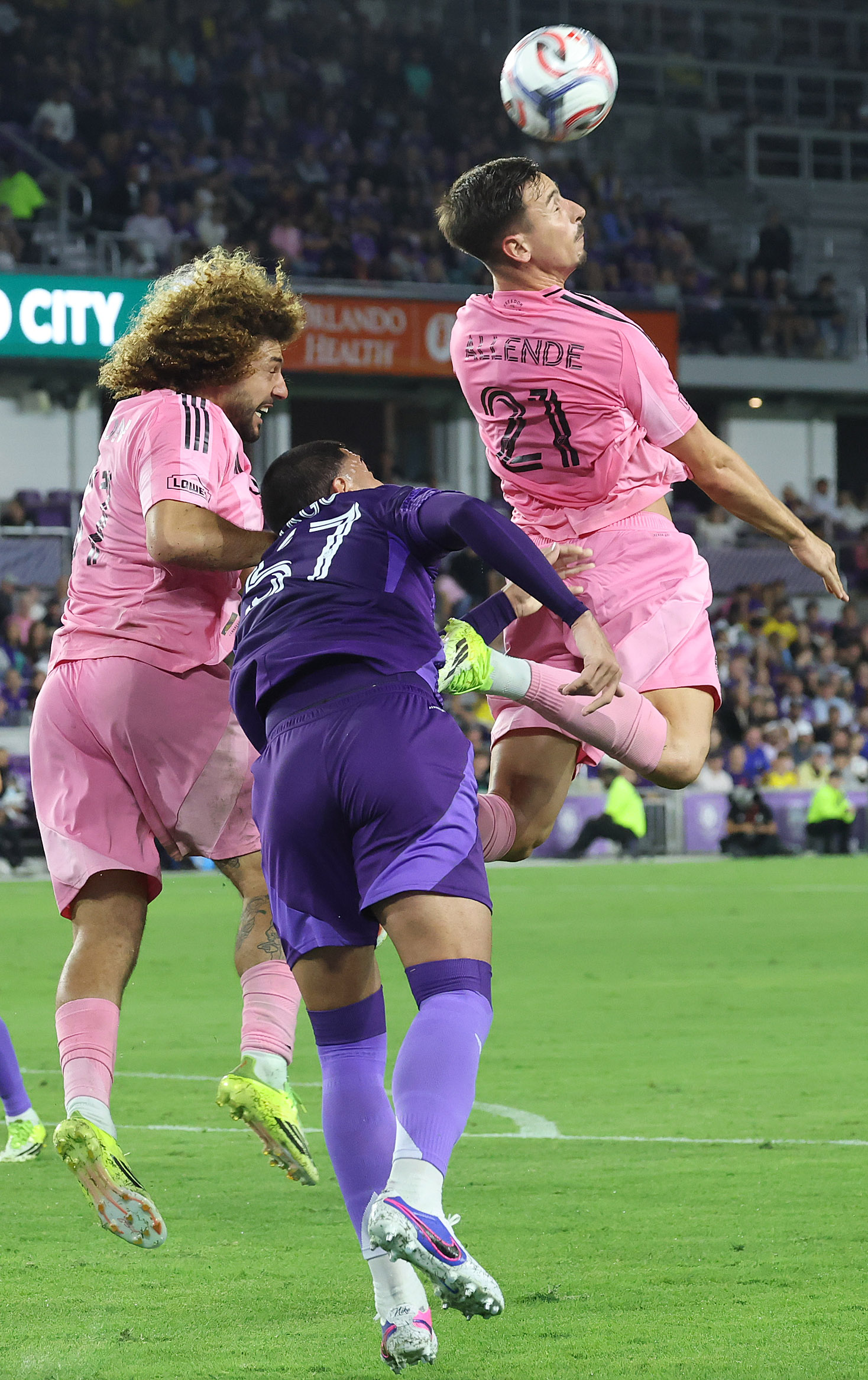 Miami player Tadeo Allende (21) heads the ball during the...