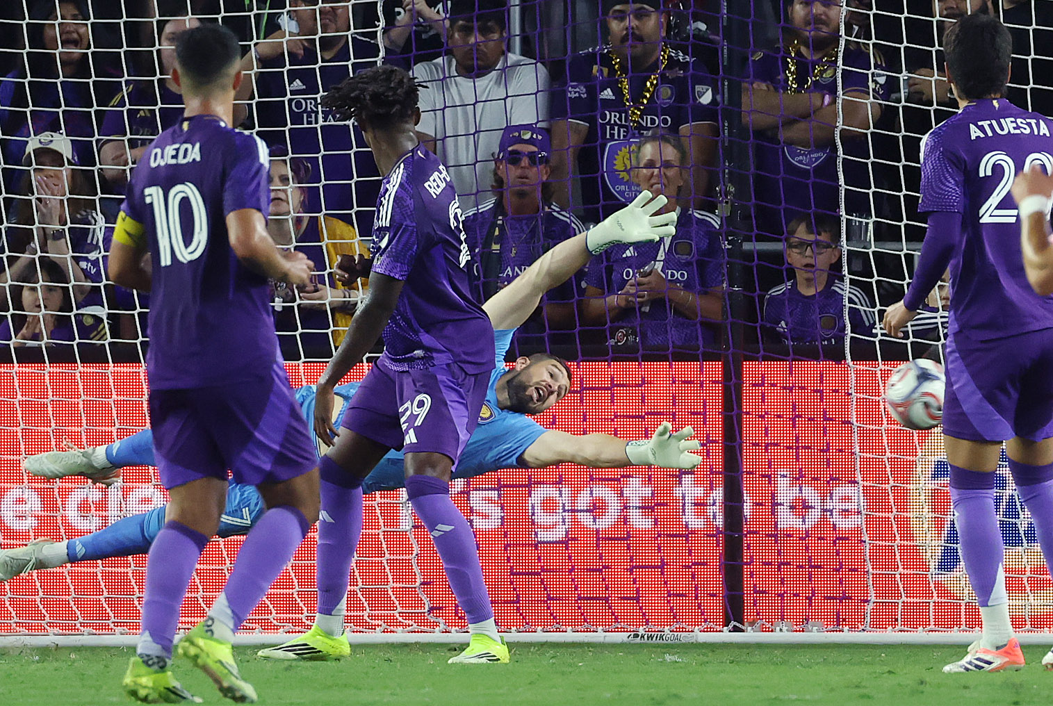 Orlando goalkeeper Maxime Crepeau (middle) dives but cannot stop a...