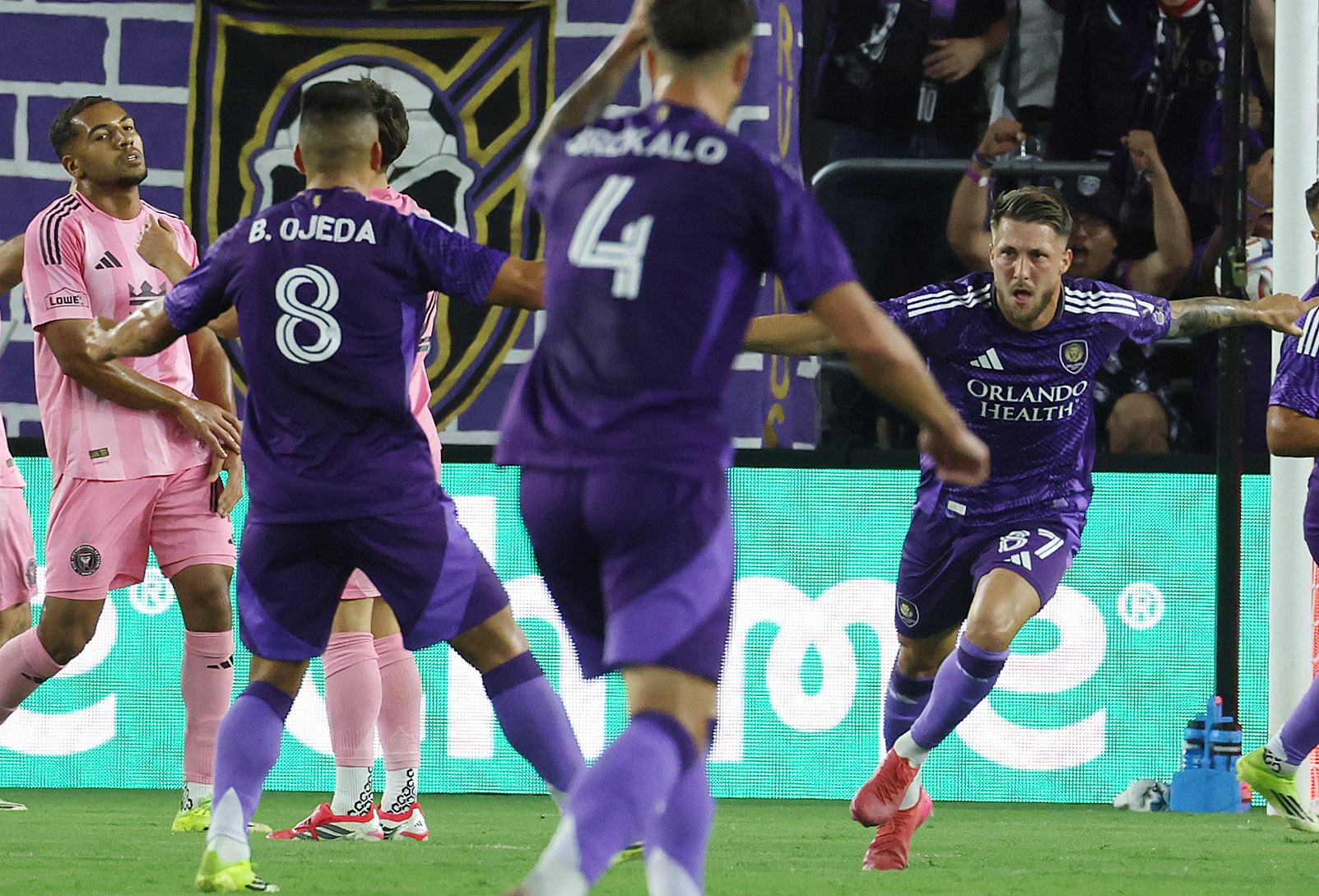 Orlando player Marco Pasalic (87) celebrates with teammates after he...